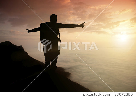silhouette adventurer team on the mountain 33072399