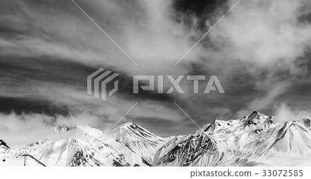 Black and white winter snowy mountains in fog Black and white winter snowy mountains in fog 33072585