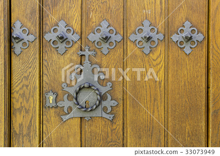 Old medieval wooden door with lock Old medieval wooden door with lock 33073949