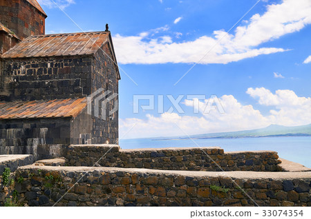 Ancient armenian church on the sky and lake Ancient armenian church on the sky and lake 33074354