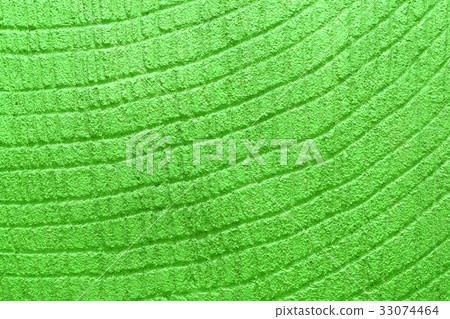 Green decorative relief plaster on wall closeup 33074464