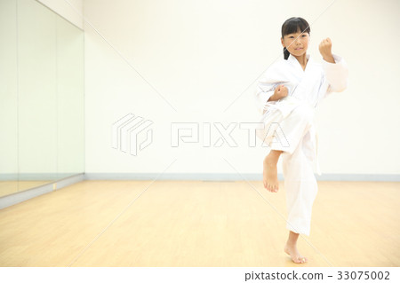 Kid doing karate Kid doing karate 33075002