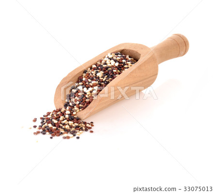 Quinoa seeds in wood spoon on white background 33075013
