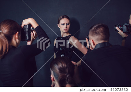 Photographers paparazzi take photos of beautiful Photographers paparazzi take photos of beautiful 33078280