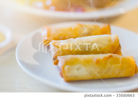 crispy spring rolls on white plate background crispy spring rolls on white plate background 33080663