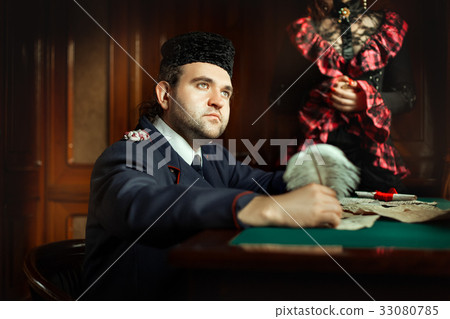 Sad retro man wrote manuscript, beside the woman. Sad retro man wrote manuscript, beside the woman. 33080785