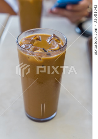 Iced coffee on white table 33081042