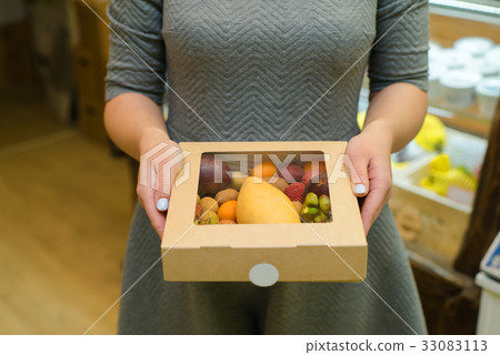 Box of fruit girl hands 33083113