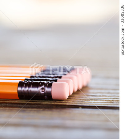Pencil with eraser on the desk 33085336
