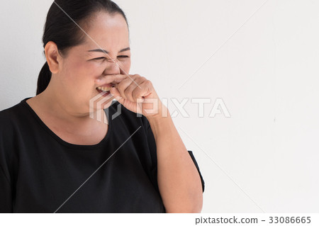 sick woman with cold sniffing 33086665