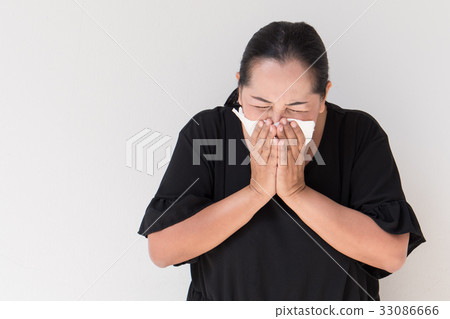 sick woman with cold or flu sneezing 33086666