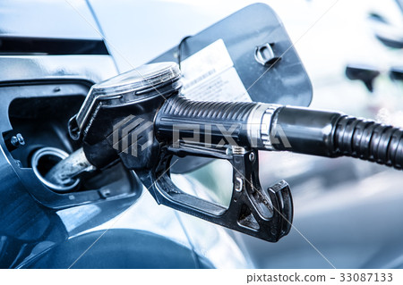 Pumping the fuel diesel or petrol on gas station. Pumping the fuel diesel or petrol on gas station. 33087133