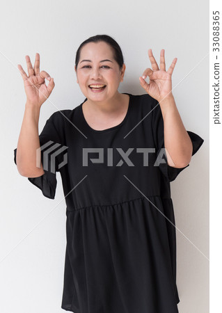 middle age woman giving ok hand sign middle age woman giving ok hand sign 33088365