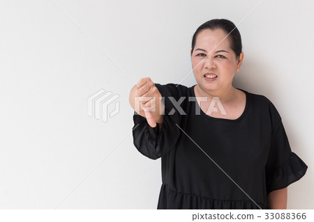 angry unhappy middle age woman giving thumb down angry unhappy middle age woman giving thumb down 33088366