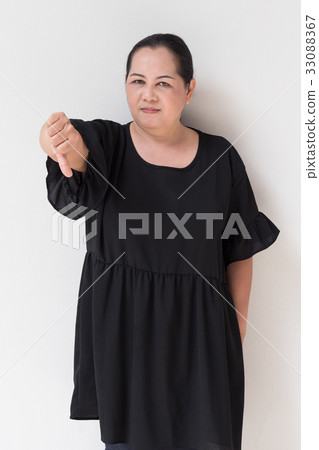 angry unhappy middle age woman giving thumb down angry unhappy middle age woman giving thumb down 33088367