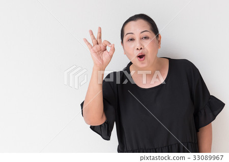 middle age woman giving ok positive hand sign middle age woman giving ok positive hand sign 33089967