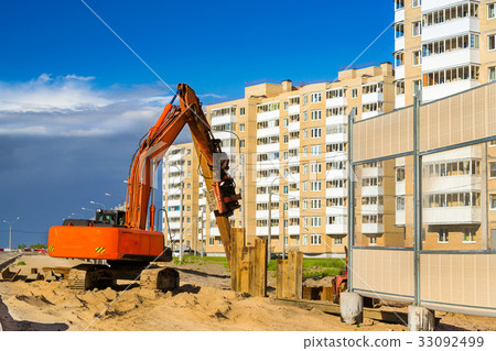 Excavator to hammer steel piles, construction road 33092499