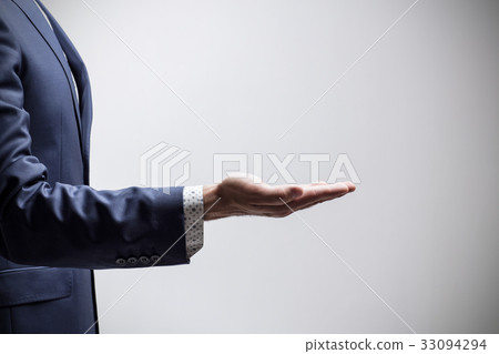 Man shows outstretched hand with open palm. Man shows outstretched hand with open palm. 33094294