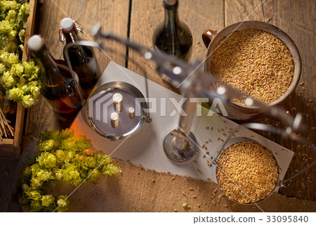 Home Brewing of Beer. Man Weighs Barley. Top View  33095840