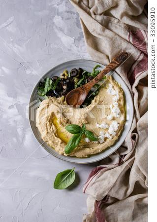 Hummus with olives and herbs 33095910