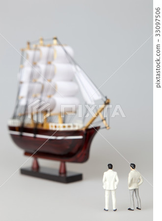 Businessman, sailboat, model Businessman, sailboat, model 33097506