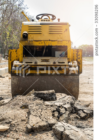 Yellow road roller in construction site Yellow road roller in construction site 33098206