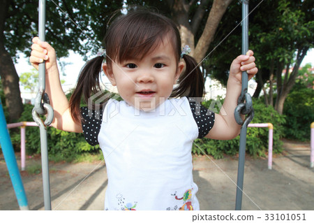 Infant playing with a swing (2 years old child) 33101051