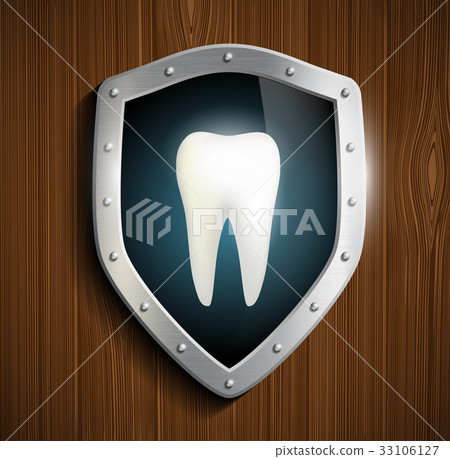 human tooth on the background of the shield 33106127