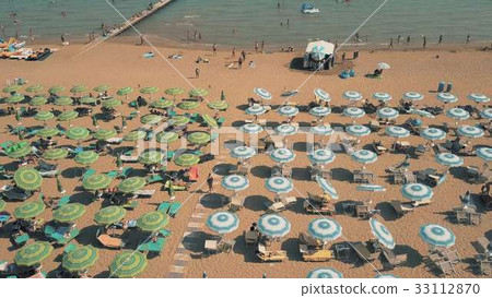 Aerial view of a big crowded sandy beach in Lido 33112870