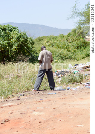 Young man on his way along Young man on his way along 33115341