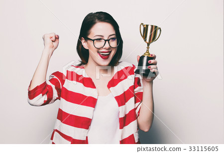 young smiling woman with cup trophy 33115605