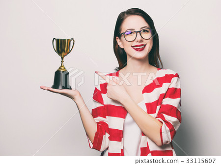 young smiling woman with cup trophy 33115607