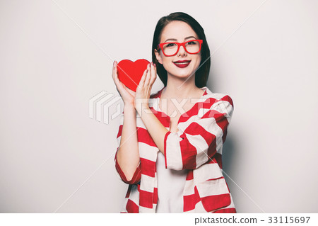 smiling woman with heart shape box 33115697