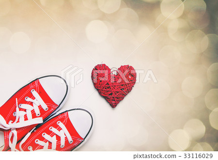 big red gumshoes and beautiful heart shaped toy 33116029
