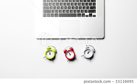 clocks and laptop 33116095