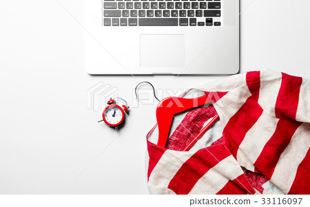 clock, jacket, hanger and laptop 33116097