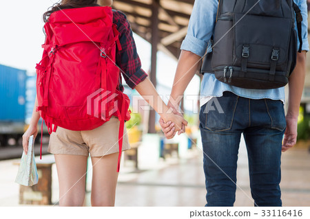 tourists with backpack at the train station 33116416