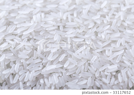 Dry uncooked rice background Dry uncooked rice background 33117652