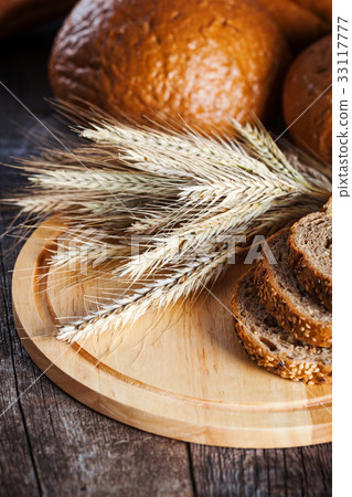Freshly baked traditional bread in assortment Freshly baked traditional bread in assortment 33117777