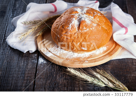 Freshly baked traditional round bread Freshly baked traditional round bread 33117779