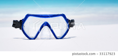 Swimming mask on white sandy seashore Swimming mask on white sandy seashore 33117923