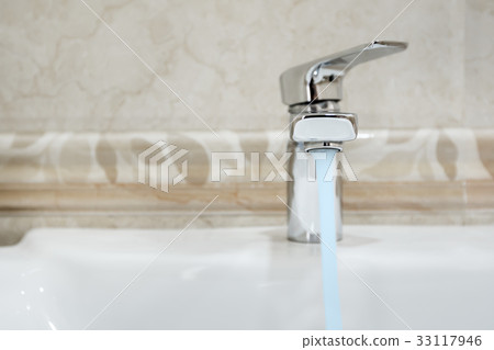 Modern metal faucet in bathroom Modern metal faucet in bathroom 33117946