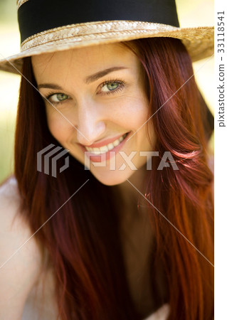 Close up portrait of sexy young lady in straw hat. 33118541