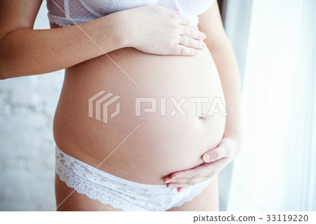 Close up of a cute pregnant belly Close up of a cute pregnant belly 33119220