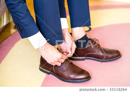 The man wears shoes 33119264