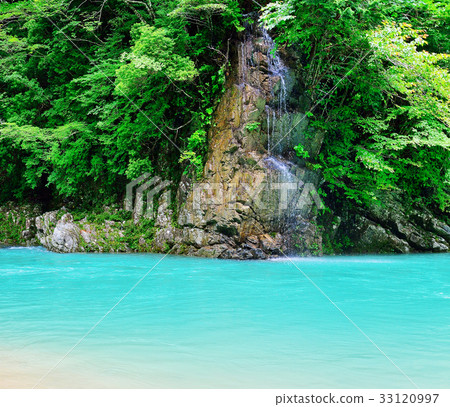 Unexplored mountainous area of emerald green river paradise Unexplored mountainous area of emerald green river paradise 33120997