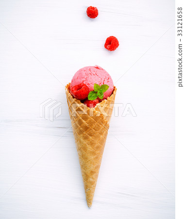 Raspberry ice cream in cone . Raspberry ice cream in cone . 33121658