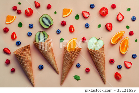 Cones and colorful various fruits raspberry. 33121659