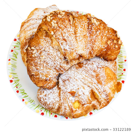 top view of three fresh croissants on plate top view of three fresh croissants on plate 33122189