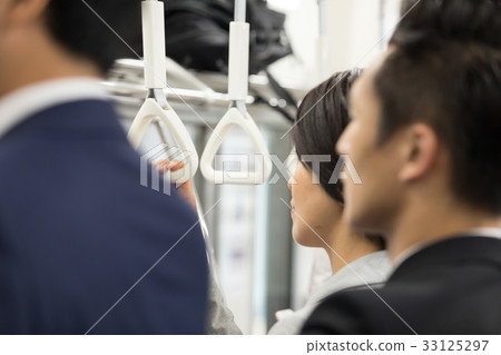 Women's hand holding a strap in the commuter train Shooting cooperation "Keio Electric Railway Co., Ltd." Women's hand holding a strap in the commuter train Shooting cooperation "Keio Electric Railway Co., Ltd." 33125297